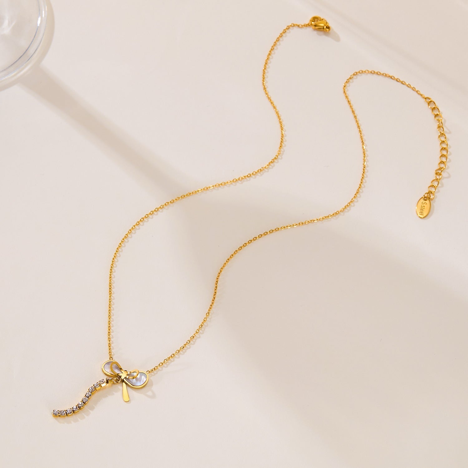 Elegant Titanium Steel Mother Shell Bow Tassel Necklace for Women